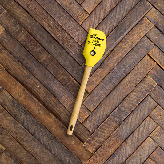 Spatula on wooden counter.
