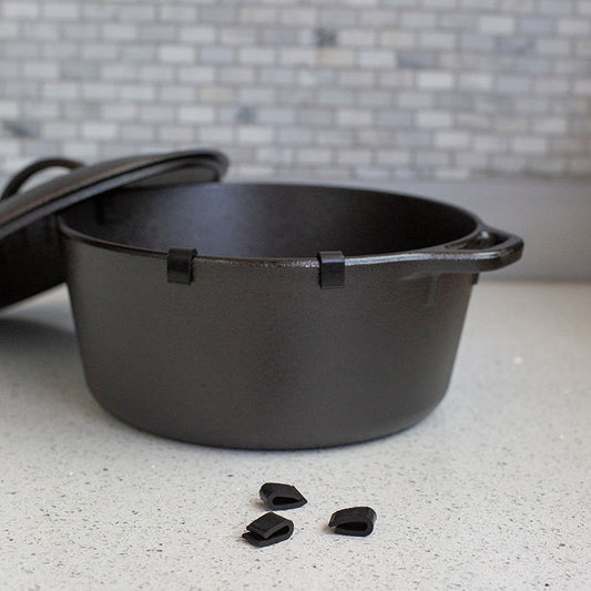 Protectors placed on cast iron dutch oven rim.