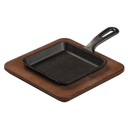 Square skillet placed in wood underliner.
