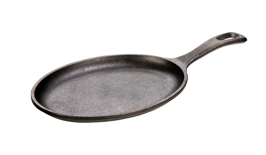 Oval shaped griddle with long handle.