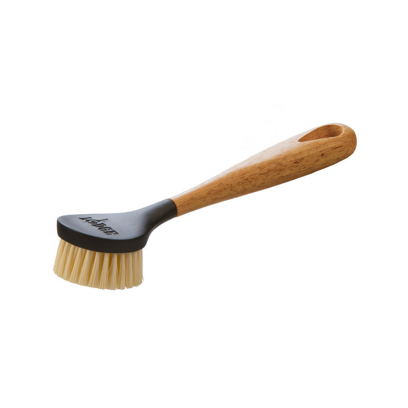 A scrub brush with a wooden handle and nylon bristles, designed for cleaning cookware.