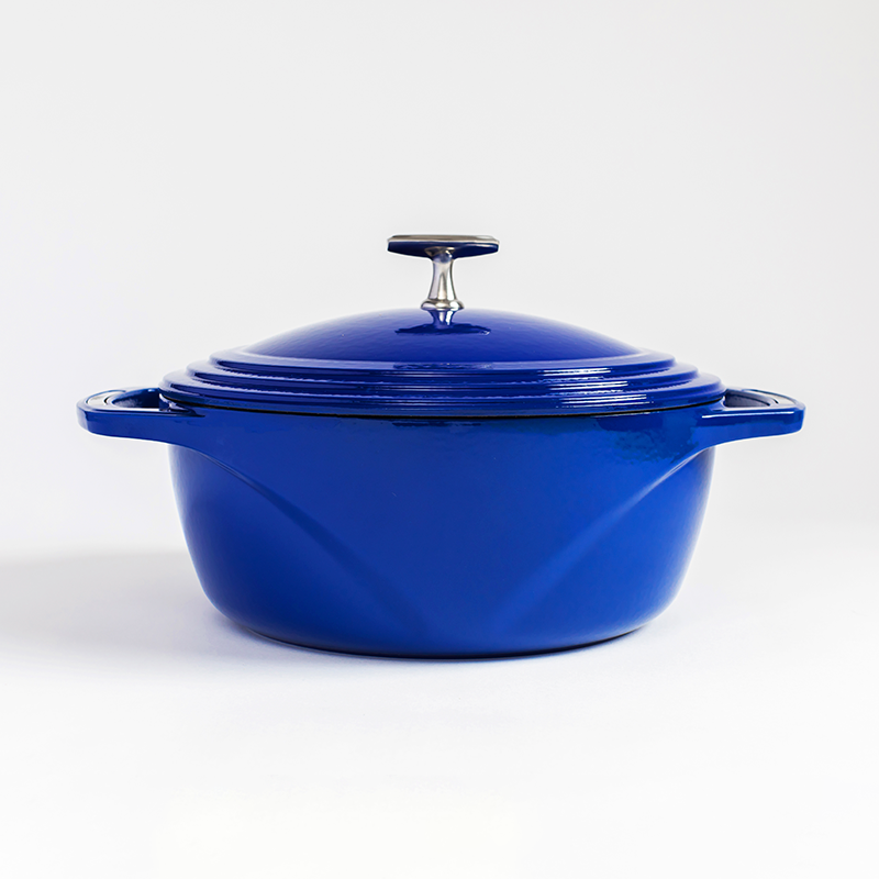 Blue enameled cast iron Dutch oven with a lid on a white background