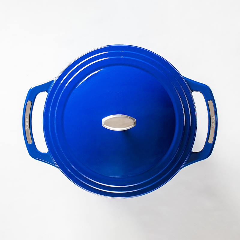 Top view of blue dutch oven featuring silver knob on lid and silver accents on handles.