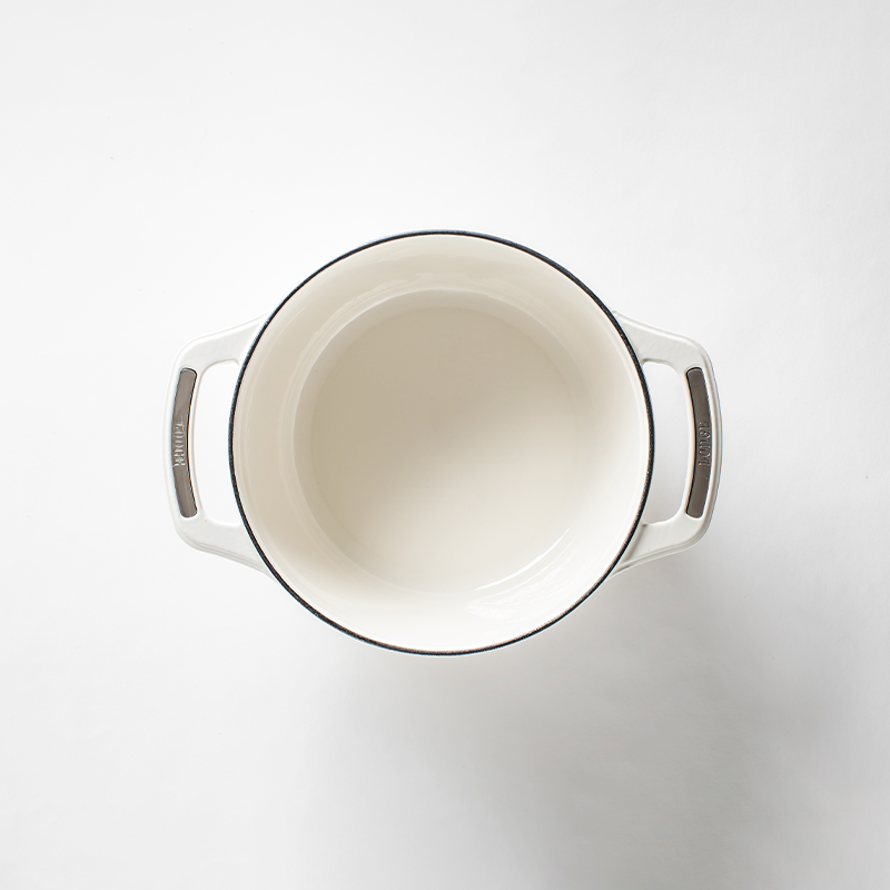 Inside of dutch oven, with a white enameled interior.