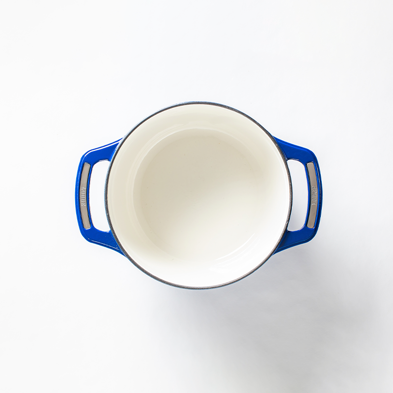 Inside of dutch oven, with a white enameled interior.