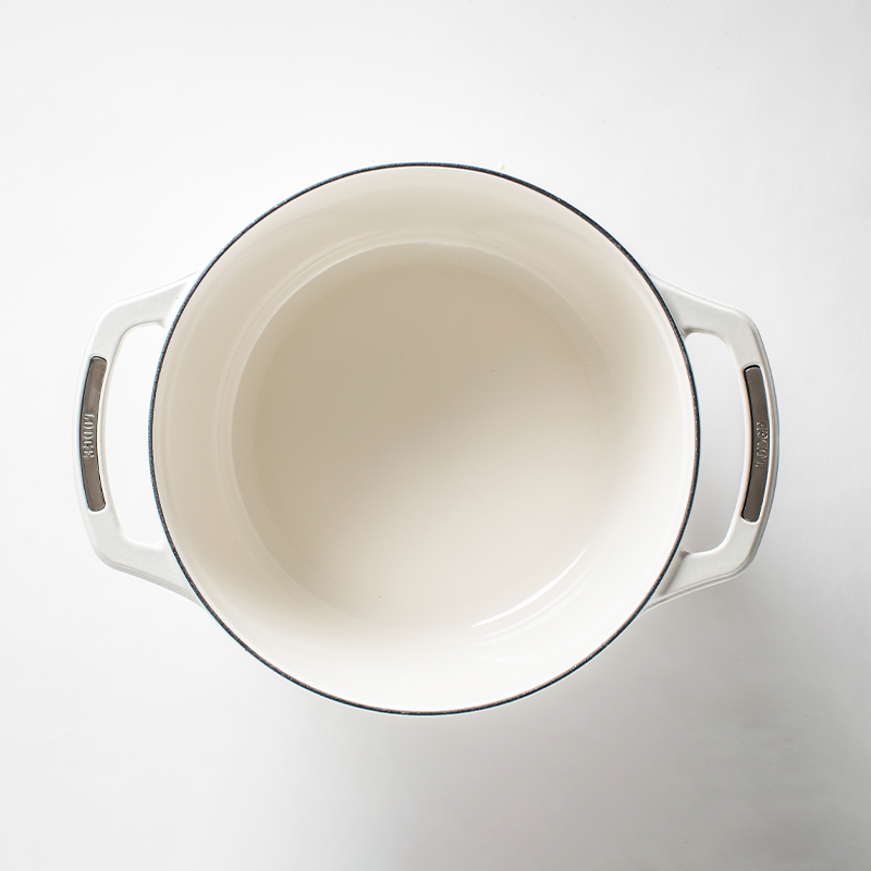 Inside of dutch oven, with a white enameled interior.