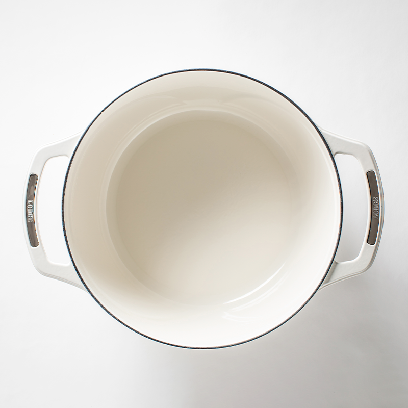 Inside of dutch oven, with a white enameled interior.