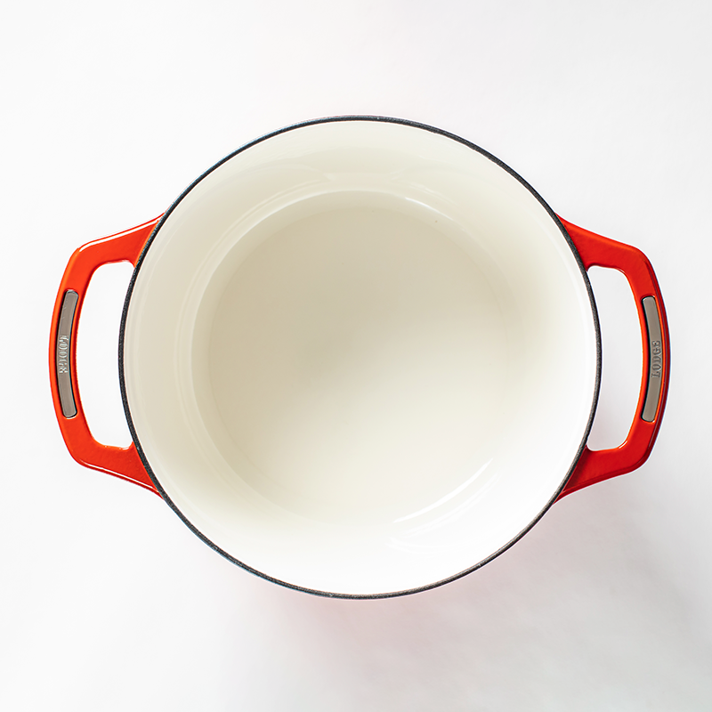 Inside of dutch oven, with a white enameled interior.