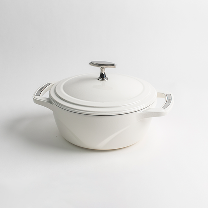 White enameled cast iron Dutch oven with a lid on a white background