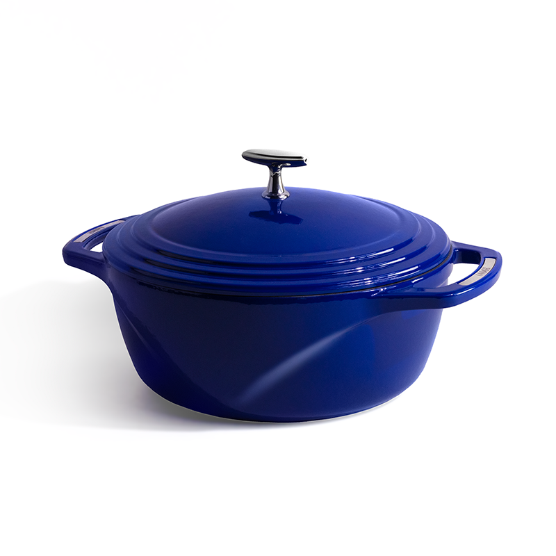 Blue enameled cast iron Dutch oven with a lid on a white background