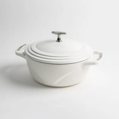 White enameled cast iron Dutch oven with a lid on a white background