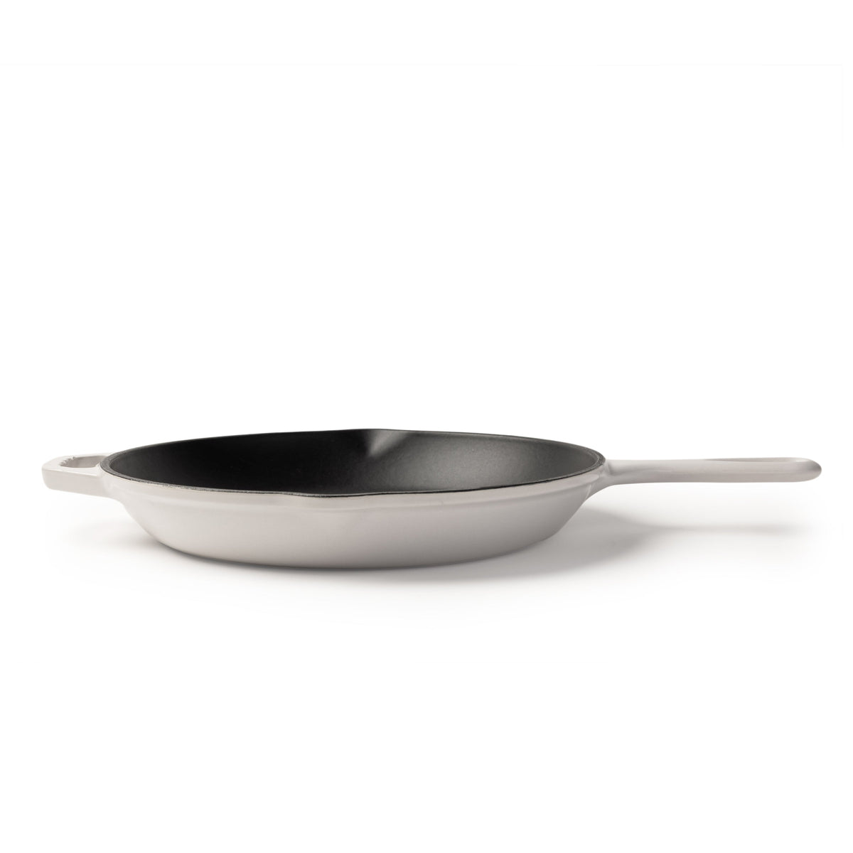 A white cast iron skillet with a black non-stick interior and a single white handle, shown on a clean white background.