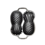 Top view of cast iron pan with 2 Pineapple-shaped molds.