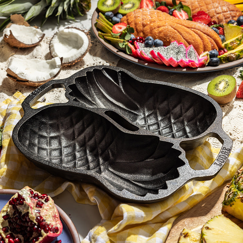 Pineapple pan in tropical environment, with pineapple cakes in background.