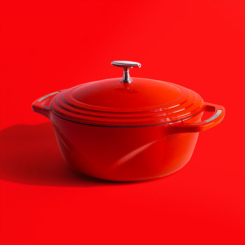 Red dutch oven on red background.