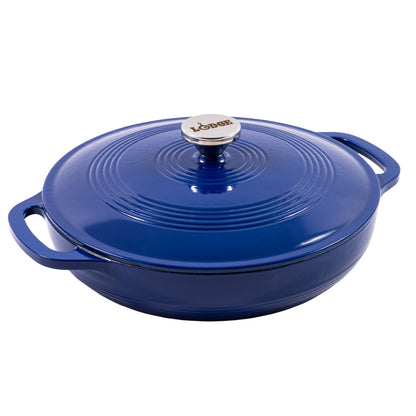 A blue enameled cast iron braiser with a matching lid, featuring side handles and a silver metal knob with the 'Lodge' brand name, shown on a solid white background.