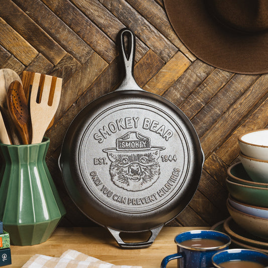 Bottom of Smokey Bear skillet displayed on kitchen counter.