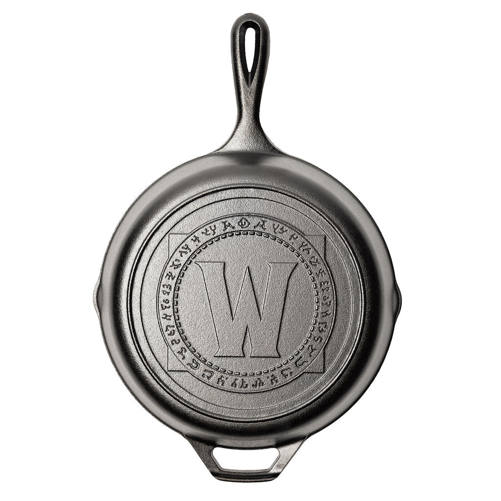 Cast iron skillet with a World of Warcraft engraved logo.