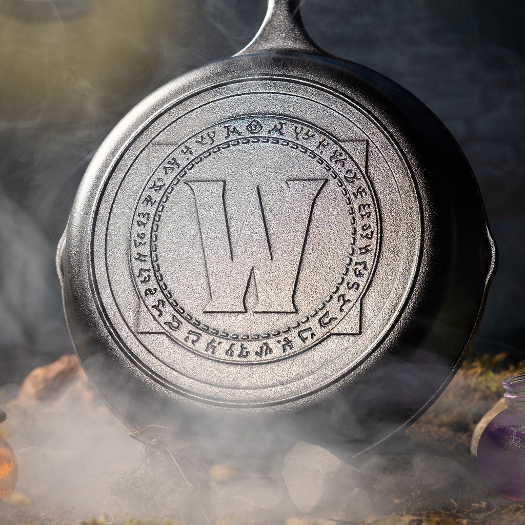 Close-up of W.O.W. skillet on a smoky background.