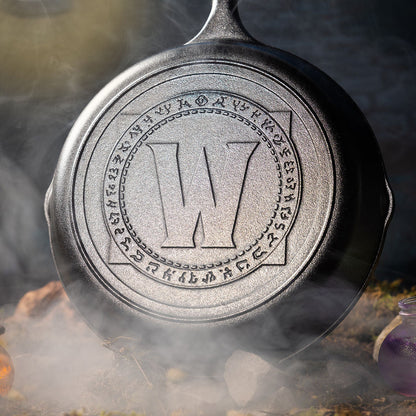 Close-up of W.O.W. skillet on a smoky background.