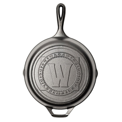 Cast iron skillet with a engraved logo on a white background