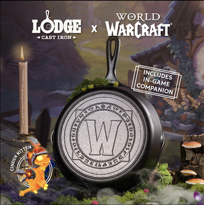 Cast iron skillet with World of Warcraft logo and 'Lodge Cast Iron' branding against a fantasy-themed background.