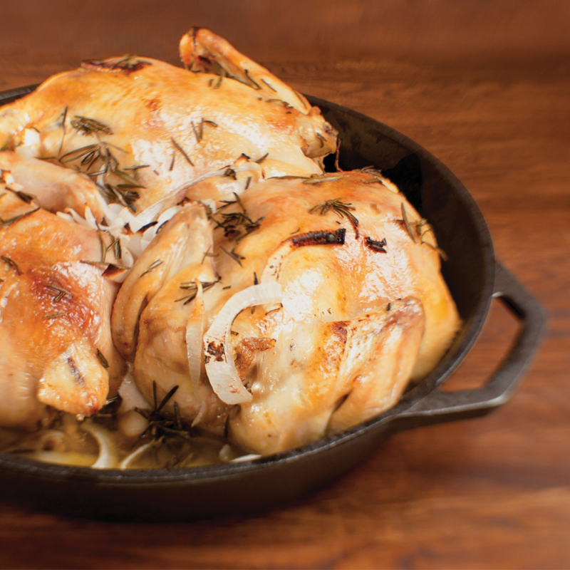 Chicken served in cast iron skillet.