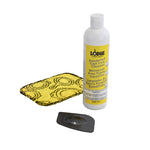 3 piece enamel cleaning set including a black and yellow scrub cloth, black pan scraper, and a 12 ounce bottle of enamel cleaner.