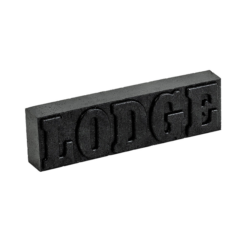 Black rectangular block with 'LODGE' embossed on a white background