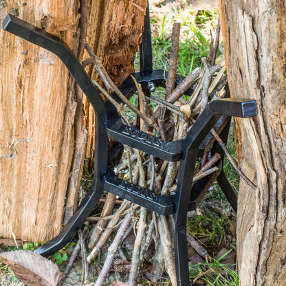Stand holding sticks for campfire.