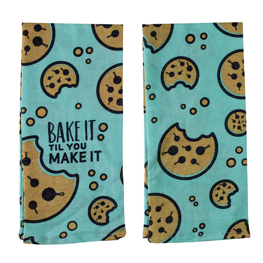 Folded turquoise towel, visual of the front and back, with chocolate chip cookie graphics throughout and the text "Bake it Til You Make It" on the front.
