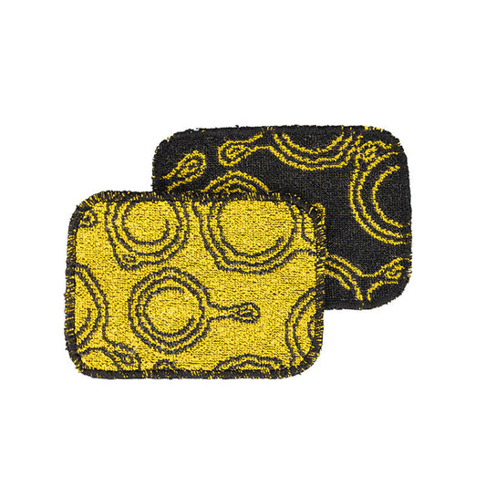 Top view of cloth's, one has yellow background with black detail and the other is the reverse.