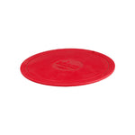 Red circular trivet with Lodge branding in center.