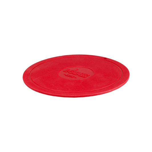 Red circular trivet with Lodge branding in center.