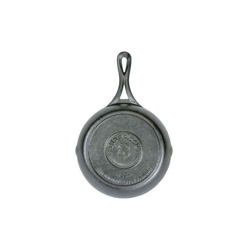 Bottom of skillet featuring the Blacklock collection logo.