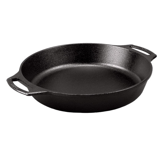 Black cast iron circular skillet with 2 loop handles.