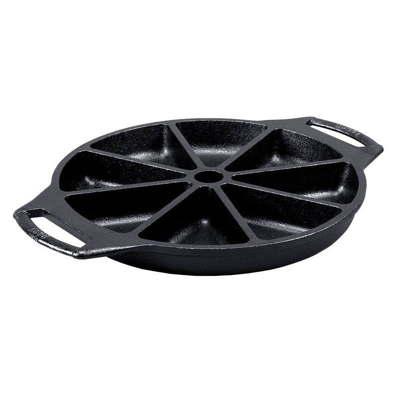 A black cast iron wedge pan with eight compartments and side handles.