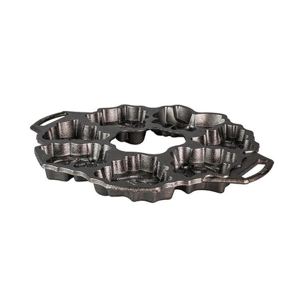 Mini cake pan with holiday themed designs that you can arrange to shape like a holiday wreath.