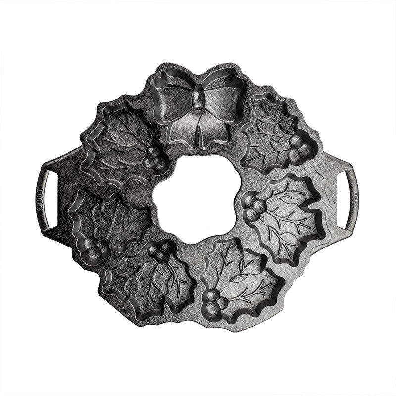 Top view of pan featuring details of the 6 mistletoe cake sections and bow.