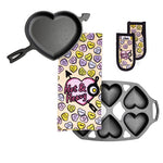 Heart themed cookware set including a heart shaped skillet, conversation heart dish towel and handle holders, and a mini cake pan to bake 6 heart-shaped treats.