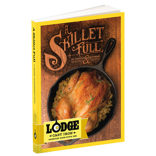 Cookbook titled 'A Skillet Full' with a yellow cover featuring a cast iron skillet and roasted chicken.