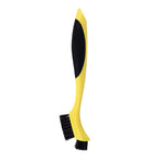 Yellow brush with black handle and 2 sets of black bristles, one in line with the handle the other sticking out of the top.