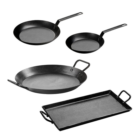 Set of four black carbon steel cookware items on a white background
