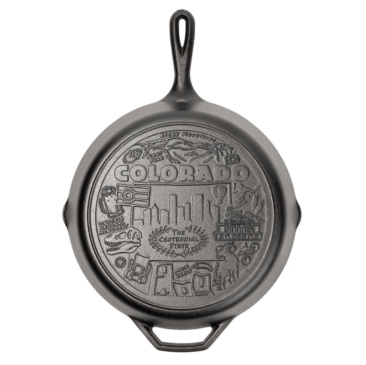 Cast iron skillet with the bottom engraved with beloved icons and monuments from Colorado.