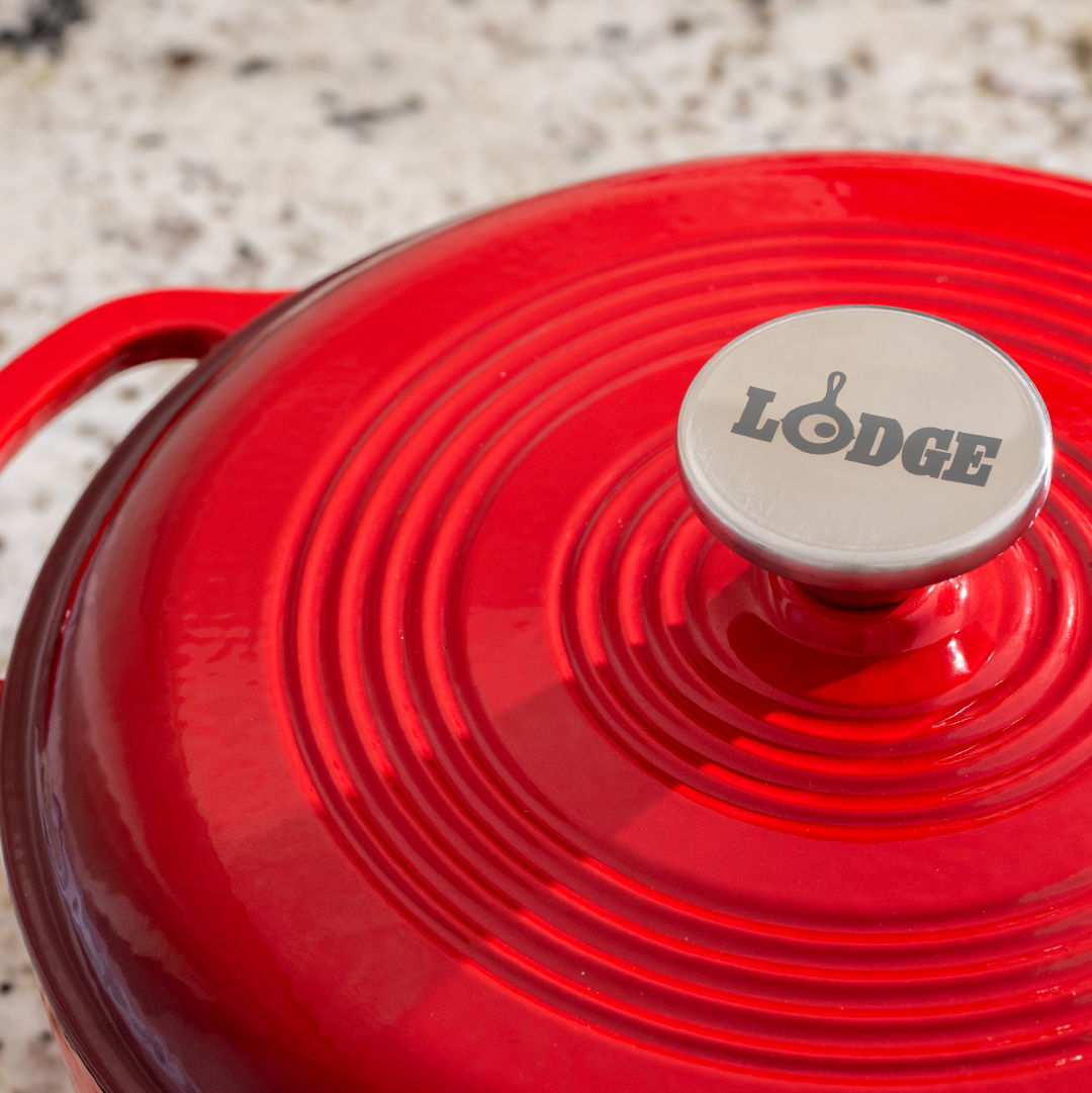 Close up of lid featuring silver knob with Lodge branding.