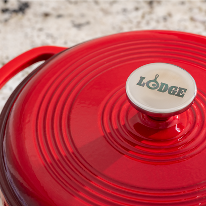 Close up of lid featuring silver knob with Lodge branding.