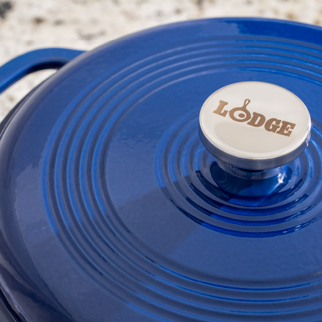 Close up of lid featuring silver knob with Lodge branding