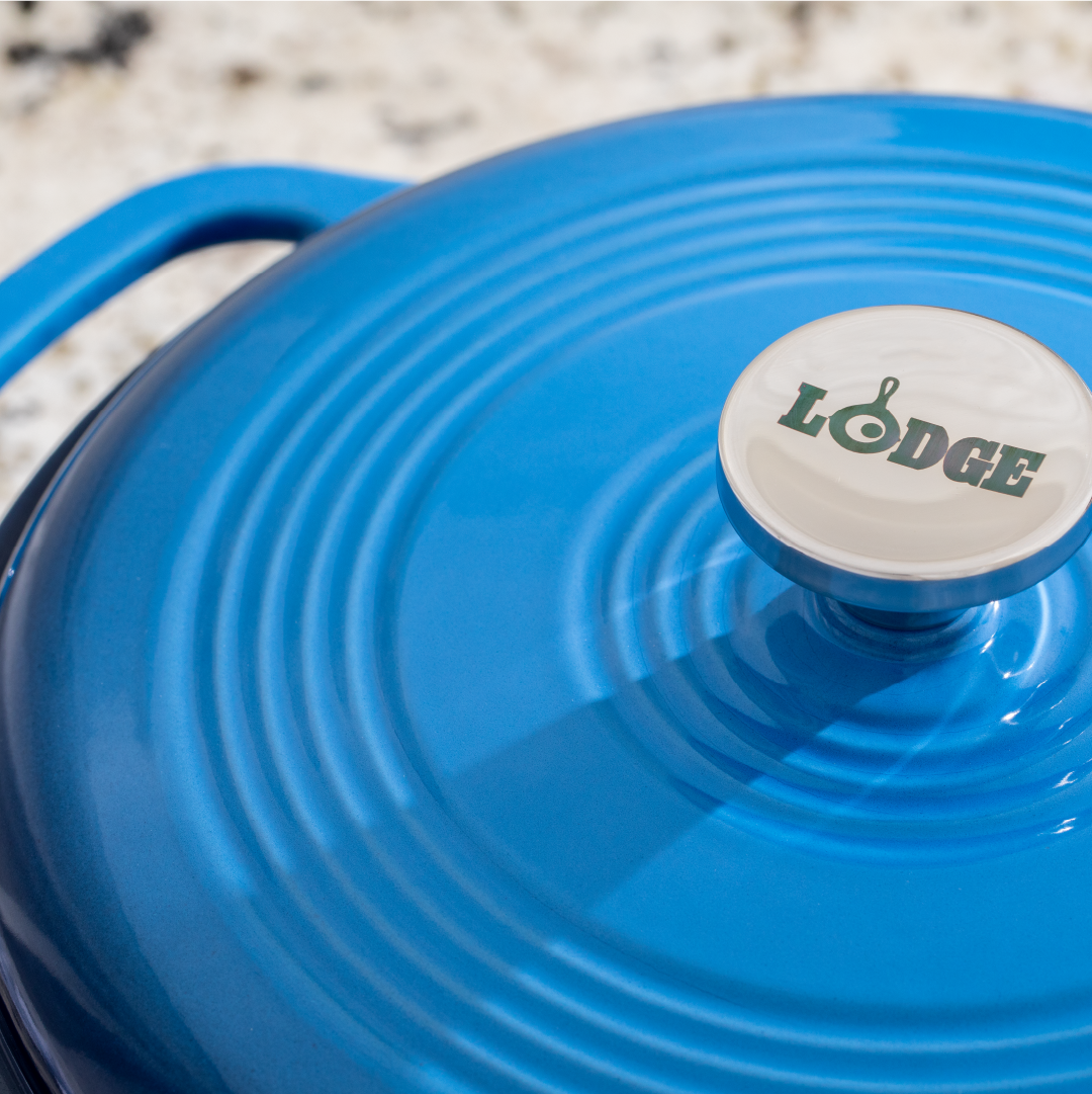 Close up of lid featuring silver knob with Lodge branding