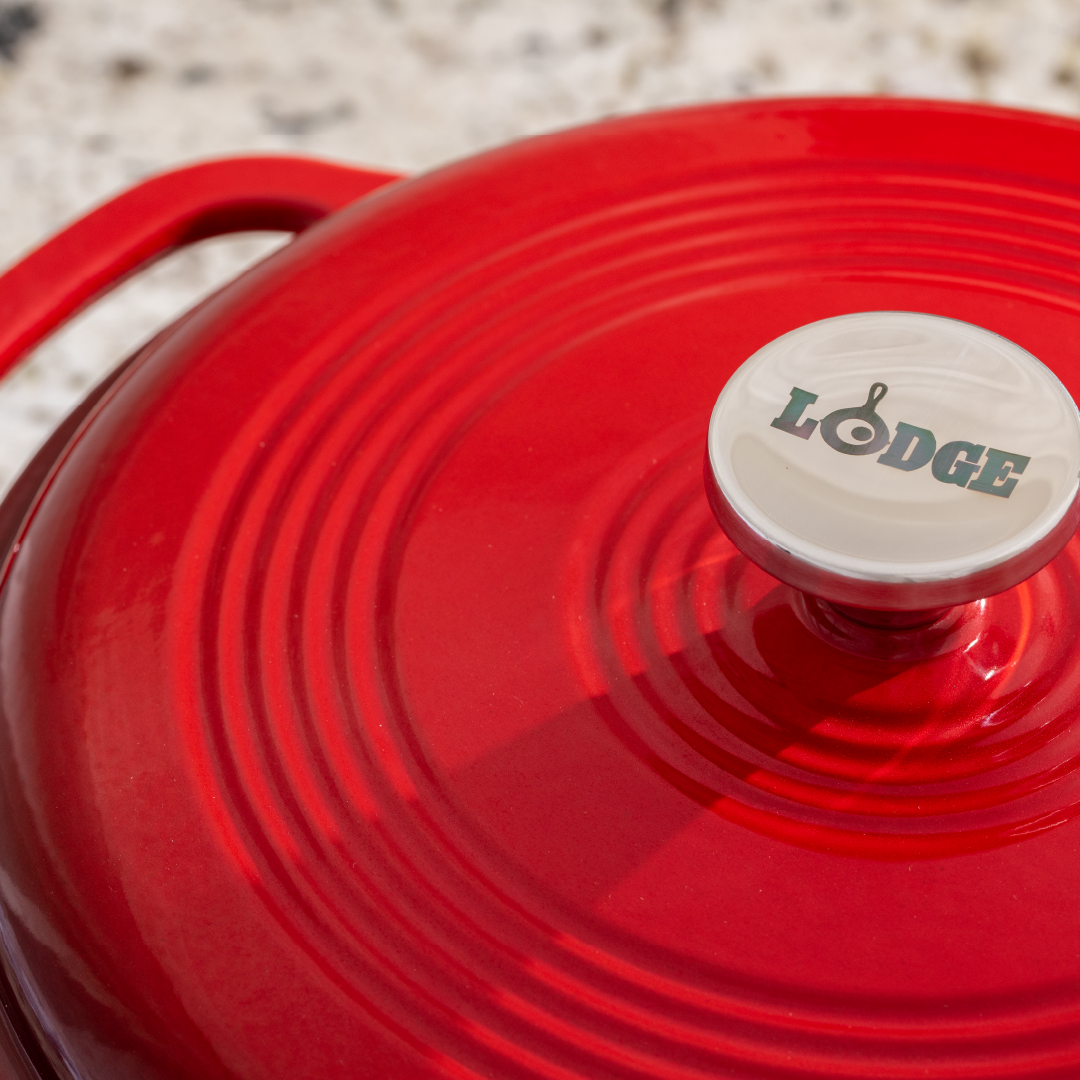 Close up of lid featuring silver knob with Lodge branding.