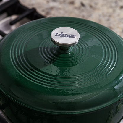 Close up of lid featuring silver knob with Lodge branding.